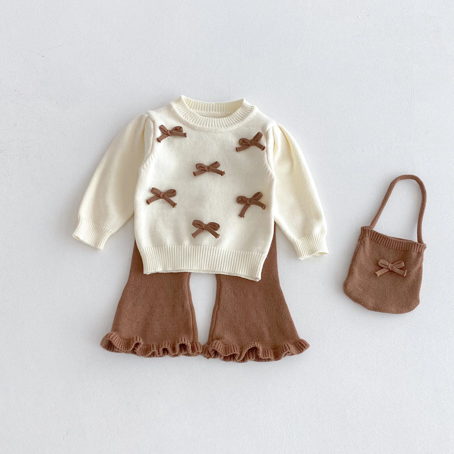 A stylish bow round-neck top, flared pants and cute bag set for baby girls in autumn and winter 2025