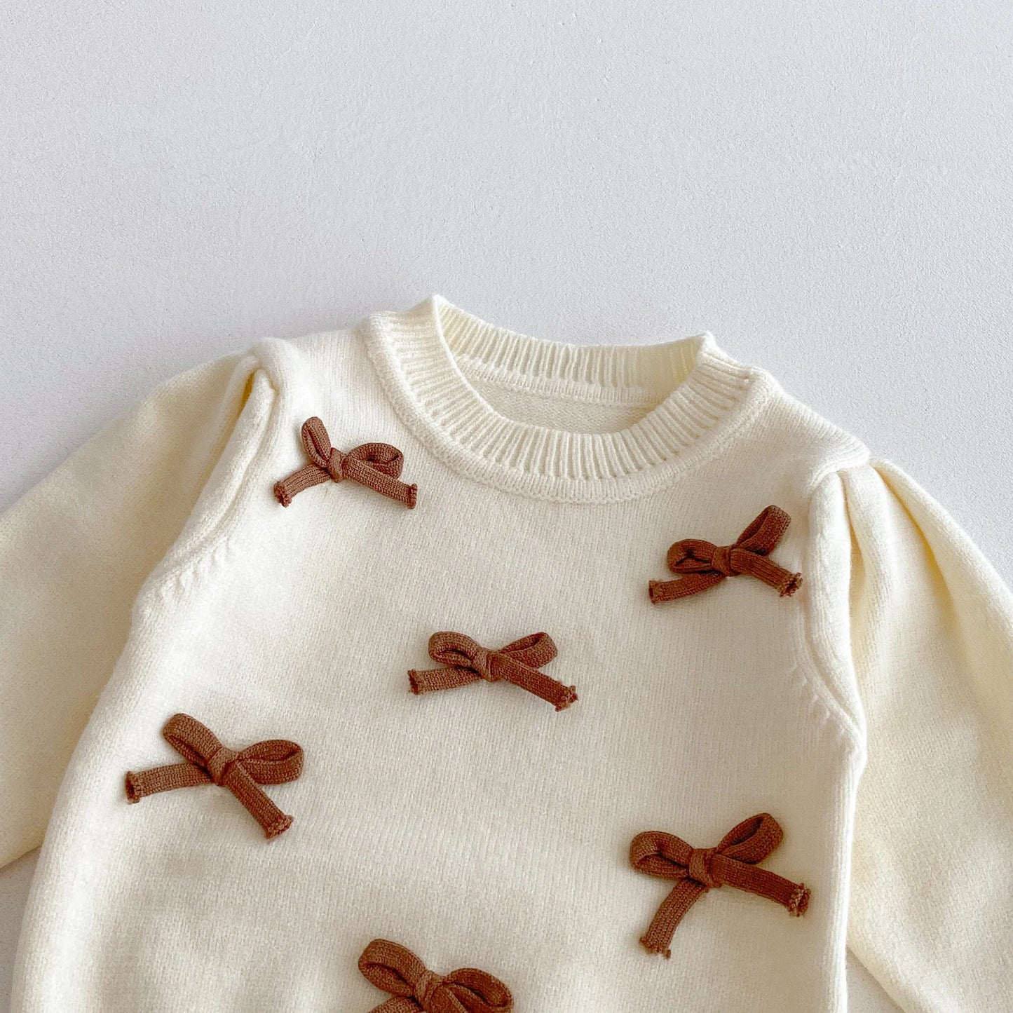 A stylish bow round-neck top, flared pants and cute bag set for baby girls in autumn and winter 2025