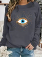 Women's autumn and winter casual fashion loose and comfortable warm eye pattern printed round neck long sleeved pullover