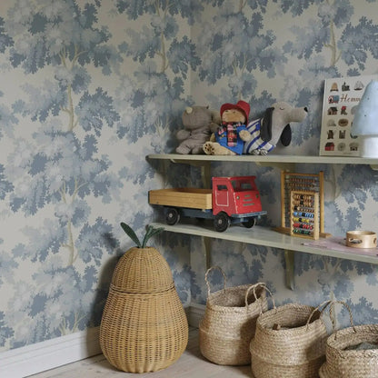Misty Forest Wallpaper with an antique woven tapestry showing a lush landscape in light blue, Scandinavian Wallpaper Raphael