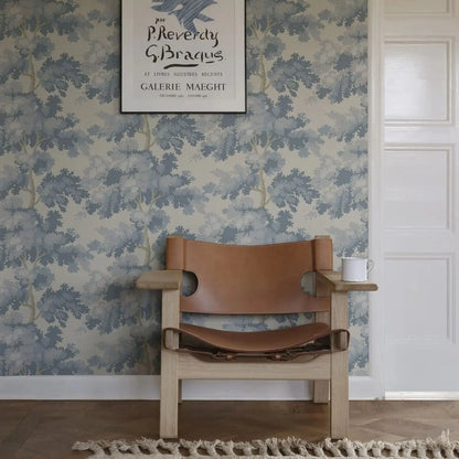 Misty Forest Wallpaper with an antique woven tapestry showing a lush landscape in light blue, Scandinavian Wallpaper Raphael