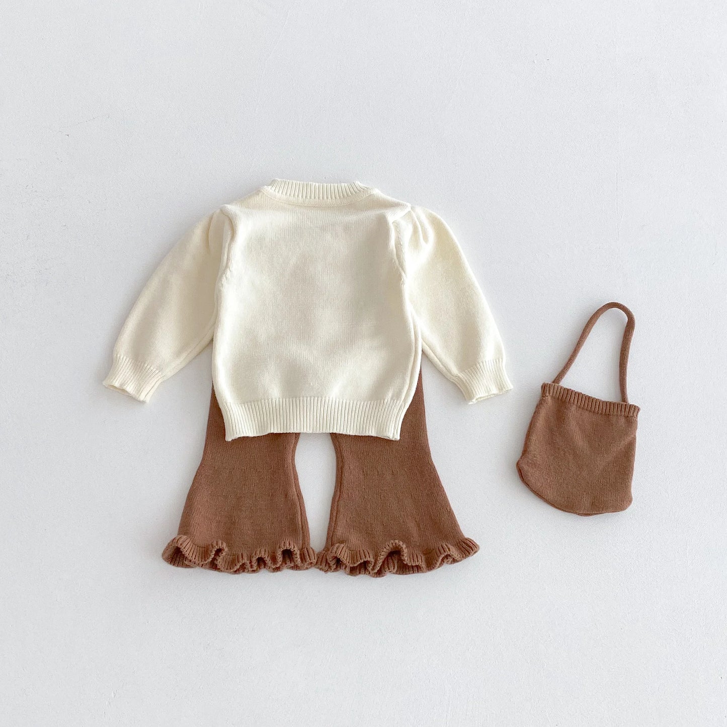 A stylish bow round-neck top, flared pants and cute bag set for baby girls in autumn and winter 2025