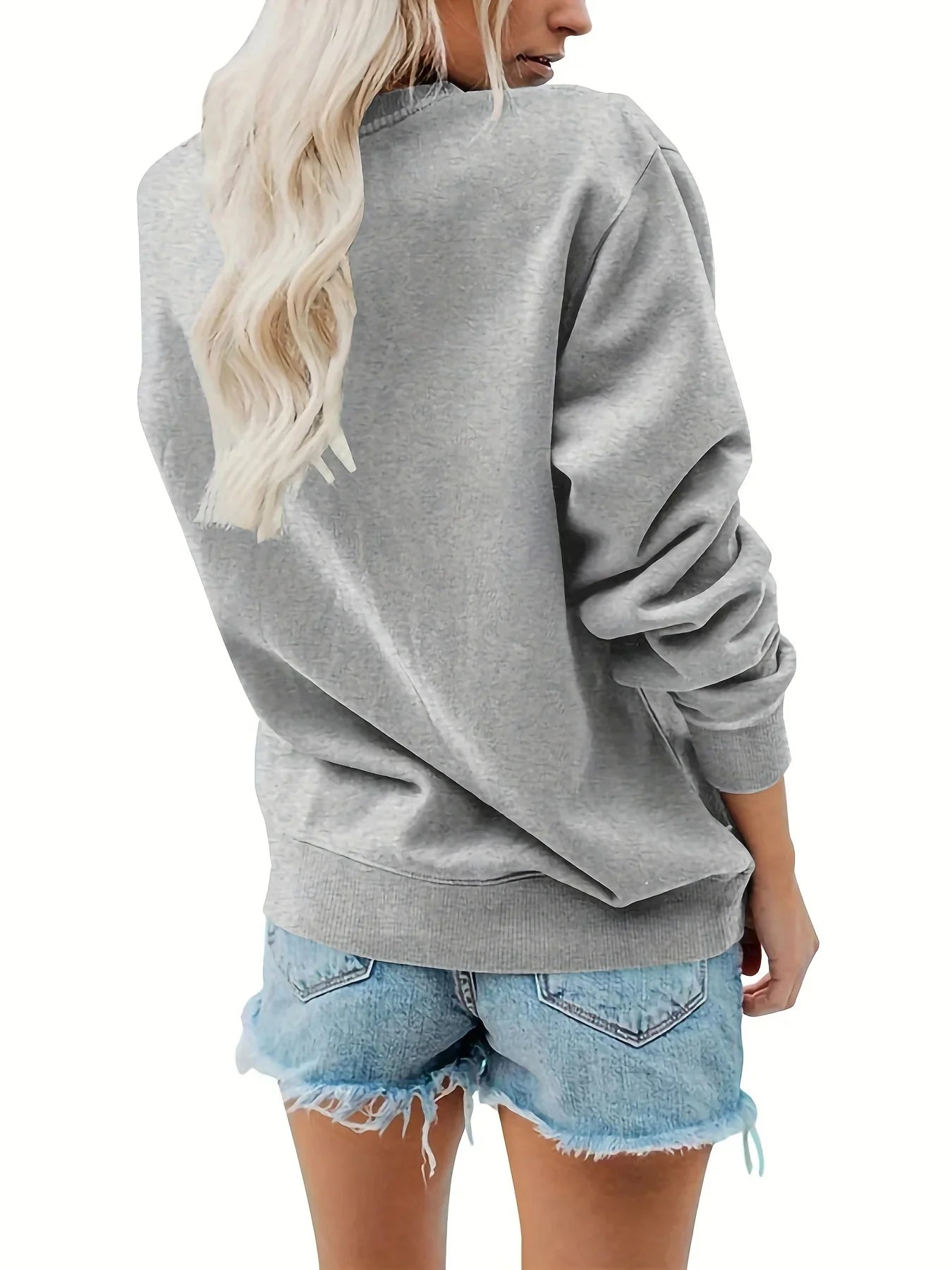 Women's autumn and winter casual fashion loose and comfortable warm eye pattern printed round neck long sleeved pullover
